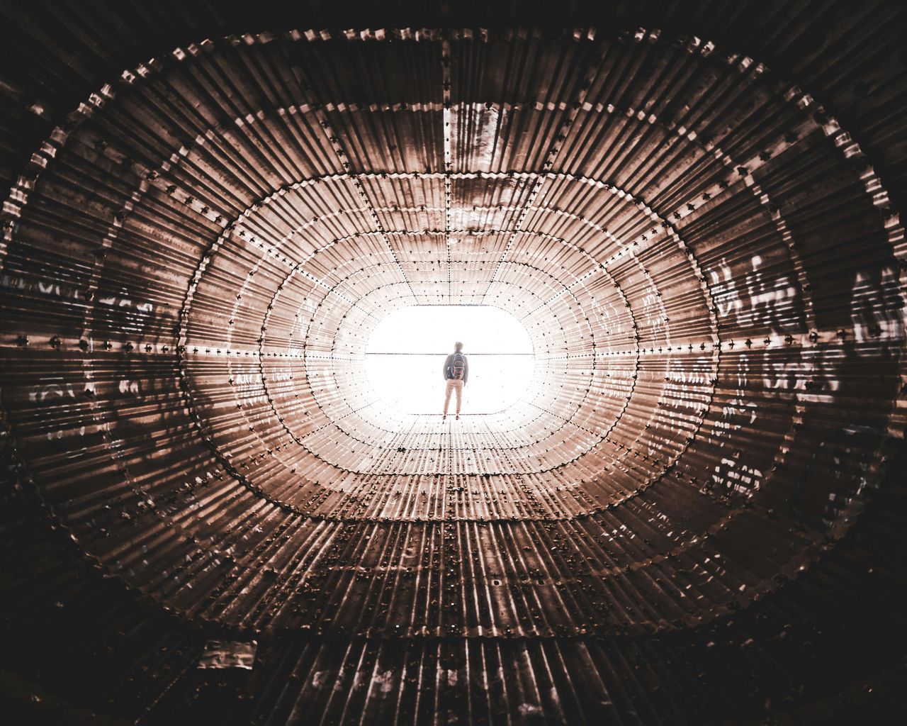 Man in White Shirt Standing on Tunnel